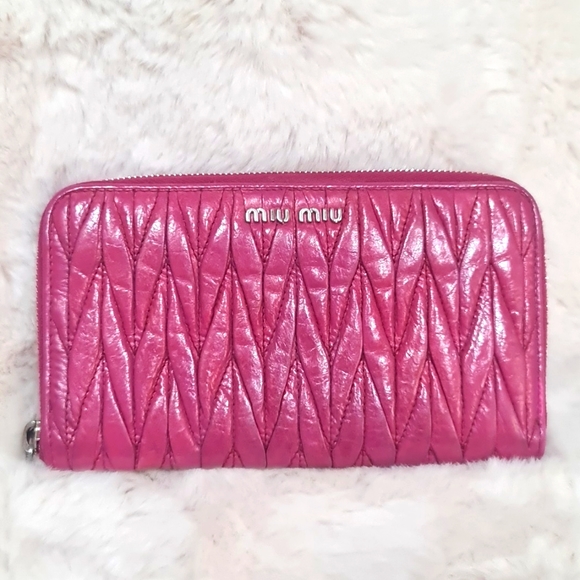 Miu Miu Handbags - Auth Miu Miu Pink Matelasse zipper wallet.